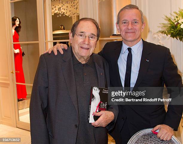 Robert Hossein and Francis Huster attend the signing of Huster's book "And Dior Created Woman" at Dior Boutique on November 19, 2012 in Paris, France.