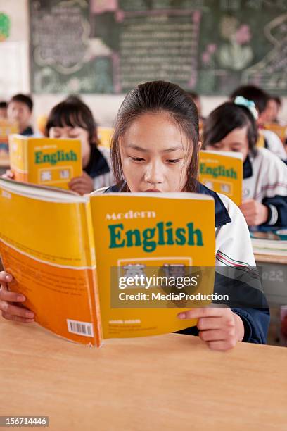 chinese students learning english at school - english culture stock pictures, royalty-free photos & images