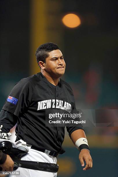 Boss Moanaroa of Team New Zealand walks back to the dugout after striking out to end the top of the first inning during Game 6 of the 2013 World...