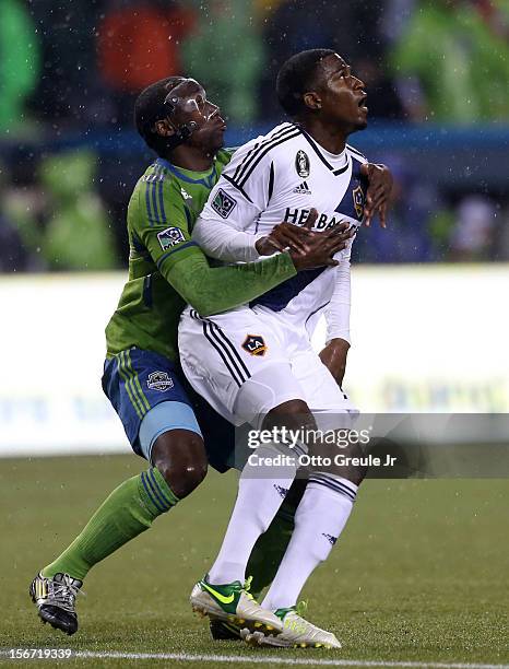 Jhon Kennedy Hurtado of the Seattle Sounders FC battles Edson Buddle of the Los Angeles Galaxy during Leg 2 of the Western Conference Championship at...