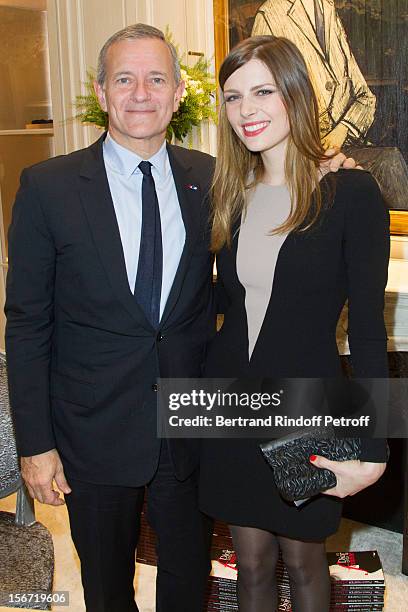 Actress and singer Elodie Frege and Francis Huster attend the signing of Huster's book "And Dior Created Woman" at Dior Boutique on November 19, 2012...