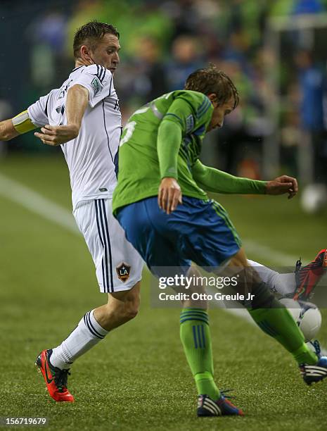 Adam Johansson of the Seattle Sounders FC dribbles against Robbie Keane of the Los Angeles Galaxy during Leg 2 of the Western Conference Championship...