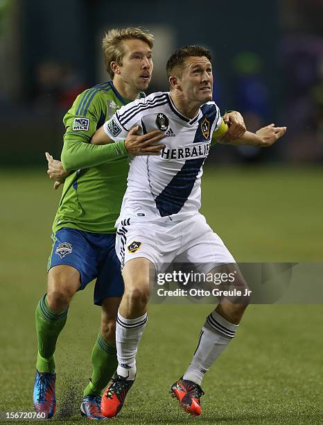 Robbie Keane of the Los Angeles Galaxy battles Adam Johansson of the Seattle Sounders FC during Leg 2 of the Western Conference Championship at...