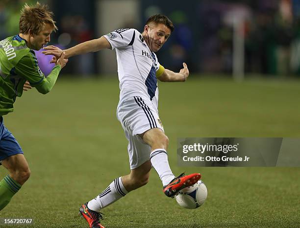 Robbie Keane of the Los Angeles Galaxy battles Adam Johansson of the Seattle Sounders FC during Leg 2 of the Western Conference Championship at...
