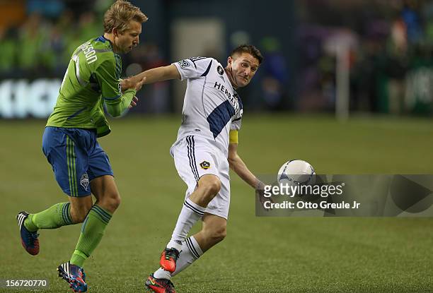 Robbie Keane of the Los Angeles Galaxy battles Adam Johansson of the Seattle Sounders FC during Leg 2 of the Western Conference Championship at...