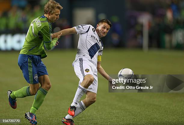 Robbie Keane of the Los Angeles Galaxy battles Adam Johansson of the Seattle Sounders FC during Leg 2 of the Western Conference Championship at...