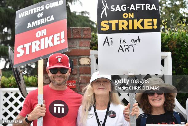 Screenwriter Damon Lindelof and US actress Frances Fisher join members of the Writers Guild of America and the Screen Actors Guild as they walk the...