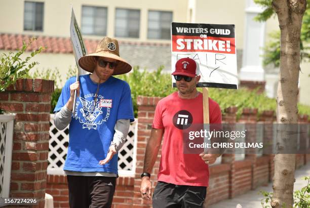 Screenwriter Damon Lindelof joins members of the Writers Guild of America and the Screen Actors Guild as they walk the picket line outside Amazon...