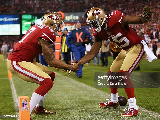 Michael Crabtree of the San Francisco 49ers and Colin Kaepernick of the San Francisco 49ers celebrate Crabtree's third quarter touchdown against the...