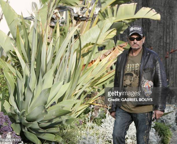 French Rock Star Johnny Hallyday arrives to give a private concert, for the birthday of his business partner, fashion designer Christian Audigier,...