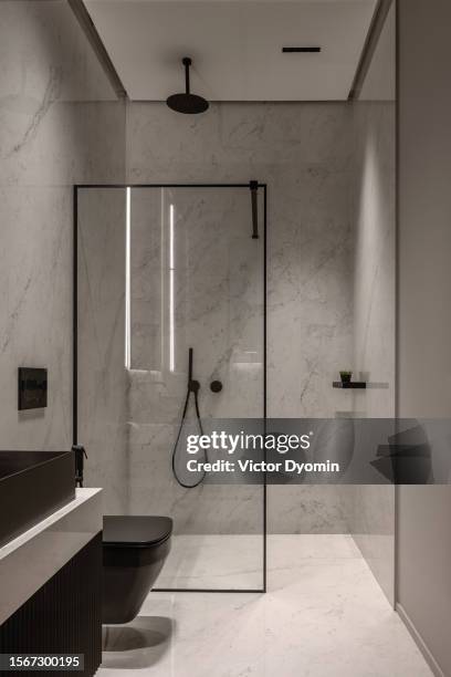glass shower partition in the stylish modern bathroom - separè foto e immagini stock