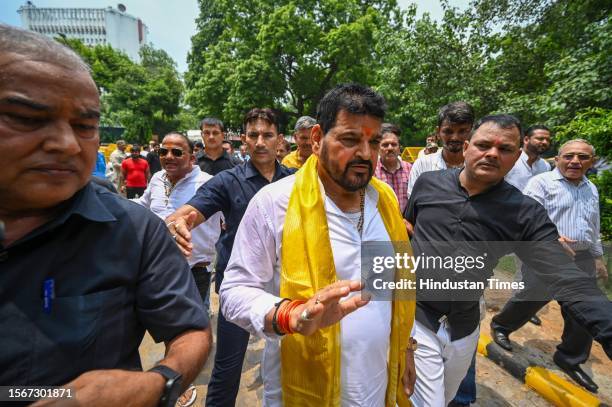 Brij Bhushan Sharan Singh, former President of Wrestling Federation of India meeting with his supporters as they leave for nomination in upcoming WFI...