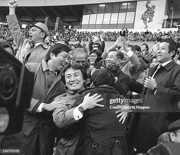 Keio University head coach Akio Ueda celebrates with team staffs after winning the All Japan Rugby Championship final match between Keio University...