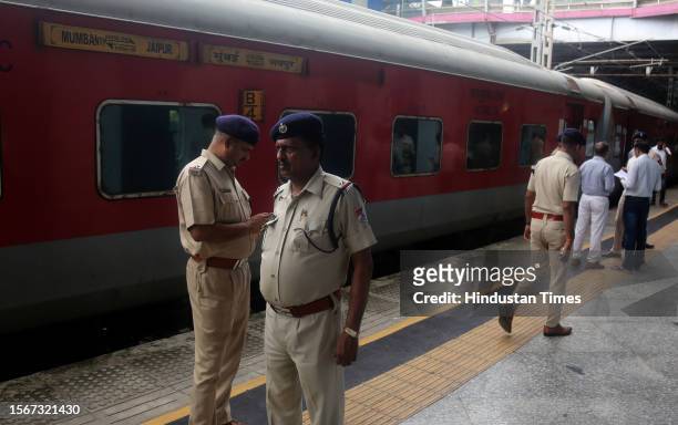 Police personnel inspect the Jaipur-Mumbai Central Express on board which a Railway Protection Force jawan shot dead four people near Palghar railway...