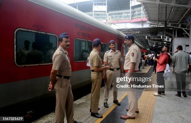 Police personnel inspect the Jaipur-Mumbai Central Express on board which a Railway Protection Force jawan shot dead four people near Palghar railway...