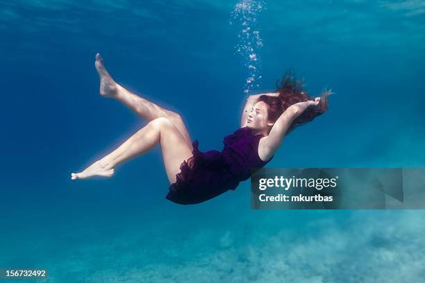 falling - woman underwater stock pictures, royalty-free photos & images