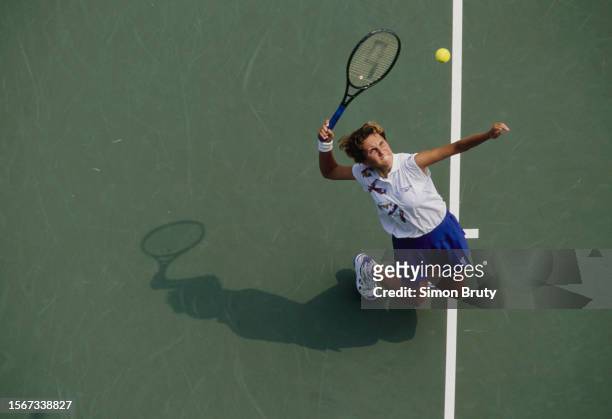 Iva Majoli from Croatia keeps her eyes on the tennis ball as she serves to Rachel McQuillan from Australia during their Women's Singles First Round...