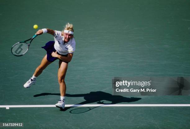 Jana Novotná from the Czech Republic keeps her eyes on the tennis ball as she serves to Martina Hingis from Switzerland during their Women's Singles...