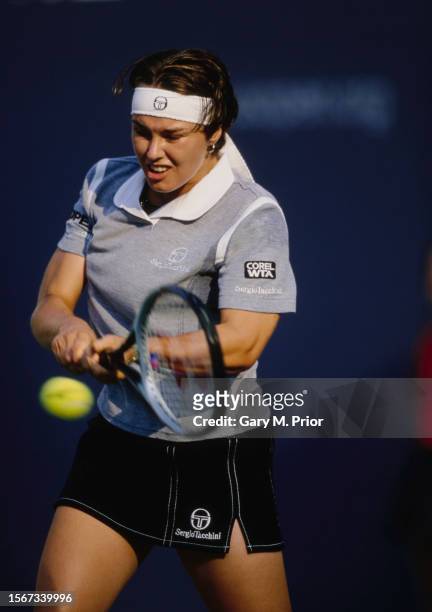 Martina Hingis from Switzerland plays a double handed backhand return to Amélie Mauresmo of France during their Women's Singles Third Round match of...
