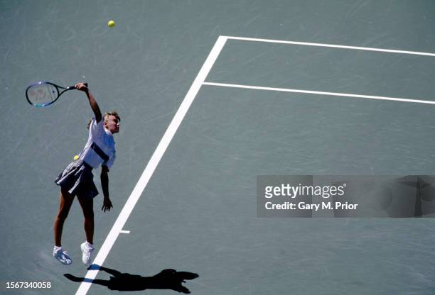 Martina Hingis from Switzerland keeps her eyes on the tennis ball as she serves to Gabriela Sabatini of Argentina during their Women's Singles Fourth...