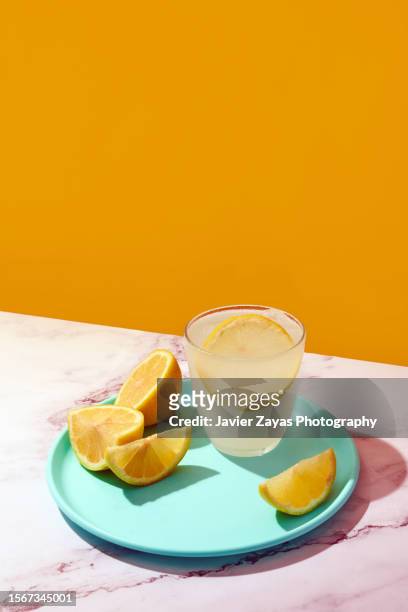fresh homemade lemonade glass on a marble surface - glass marble imagens e fotografias de stock