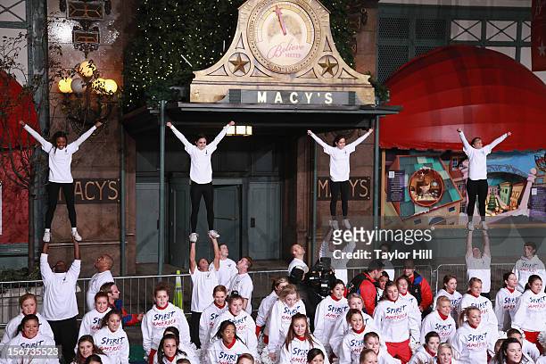 Spirit of America cheerleaders perform at Day One of the 86th Anniversary Macy's Thanksgiving Day Parade Rehearsals at Macy's Herald Square on...