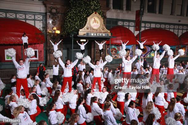 Spirit of America cheerleaders perform at Day One of the 86th Anniversary Macy's Thanksgiving Day Parade Rehearsals at Macy's Herald Square on...