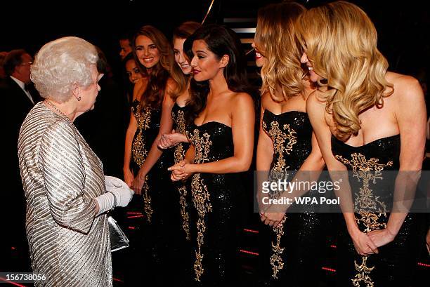 Queen Elizabeth II greets Nadine Coyle, Nicola Roberts, Cheryl Cole, Kimberley Walsh and Sarah Harding from 'Girls Aloud' at the Royal Variety...