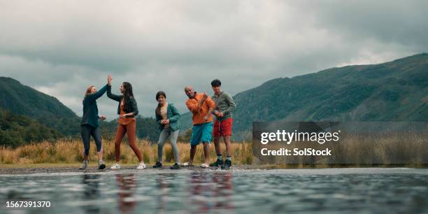 family skipping stones together - 17 loch stock pictures, royalty-free photos & images