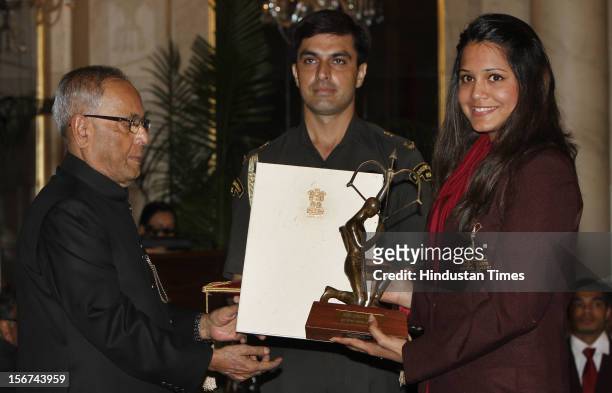 Indian President Pranab Mukherjee presenting the Arjun Award toSquash player Dipika Rebecca Pallikal during the Sports and Adventure Awards...