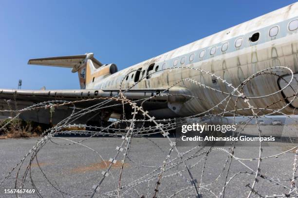 The shell of an abandoned passenger plane Hawker-Siddeley Trident of Cyprus Airways at Nicosia International Airport inside the buffer on July 19,...