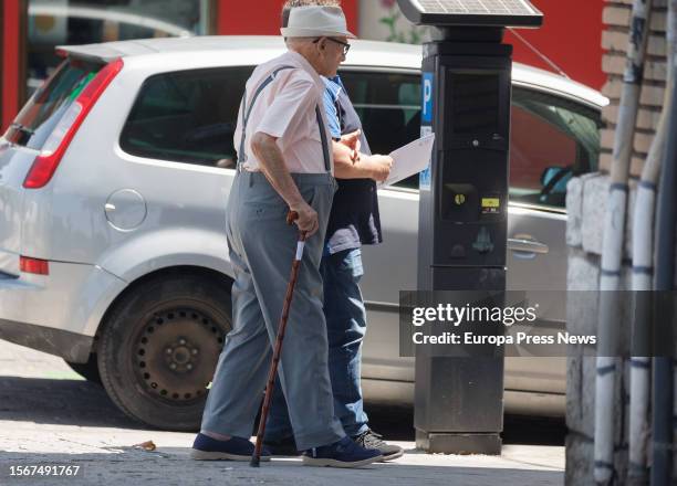 An elderly man walks leaning on a cane on July 24 in Madrid, Spain. The population over the age of 64 in Spain is over 20% of the total and exceeds...