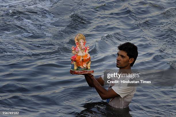 Devotees Lord Ganesh Visarjan at Ganesh Mahotsav at river Yamuna on September 29, 2012 in New Delhi, India. "