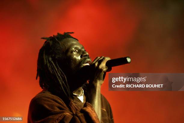 Ivorian singer Tiken Jah Fakoly performs on stage during the Sakifo festival, 07 August 2005 in Saint-Denis de la Reunion. AFP PHOTO RICHARD BOUHET