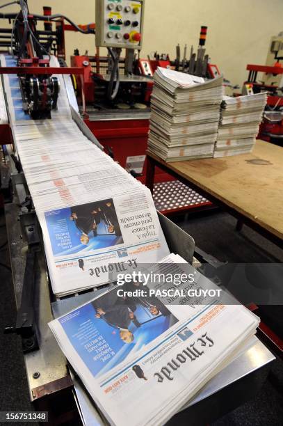 Copies of French daily newspaper "Le Monde" are pictured in the printing house of "Le Midi Libre", the southwestern newspaper on November 20, 2012 in...