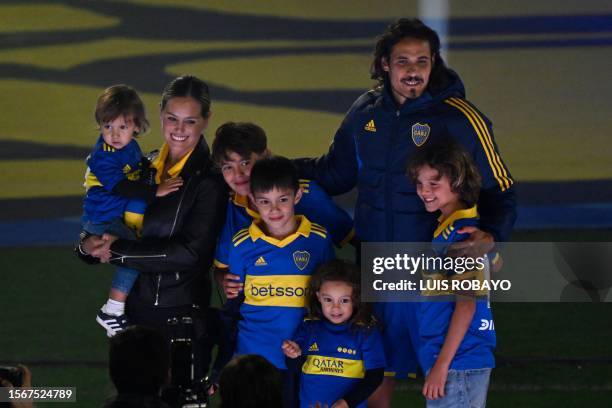 Boca Juniors' new player, Uruguayan forward Edinson Cavani, poses for a picture next to his wife Jocelyn Burgardt and his children during his...