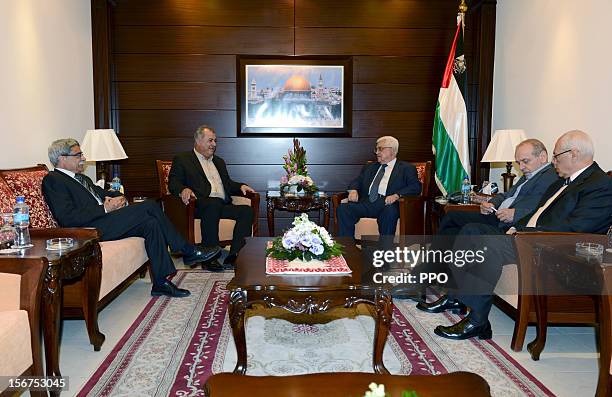 In this handout image supplied by the office of the Palestinian president, Palestinian President Mahmoud Abbas meets with Mohammad Barakeh , head of...