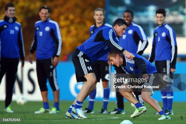 Kyriakos Papadopoulos and Lewis Holtby of Schalke 04 attend the training session at the training ground ahead of the UEFA Champions League group B...
