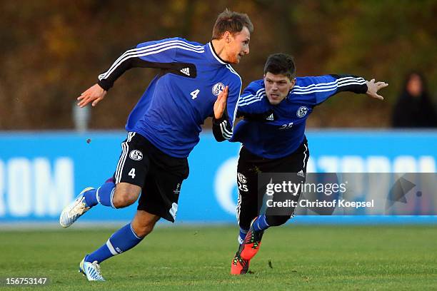 Benedikt Hoewedes and Klaas-Jan Huntelaar of Schalke 04 attend the training session at the training ground ahead of the UEFA Champions League group B...