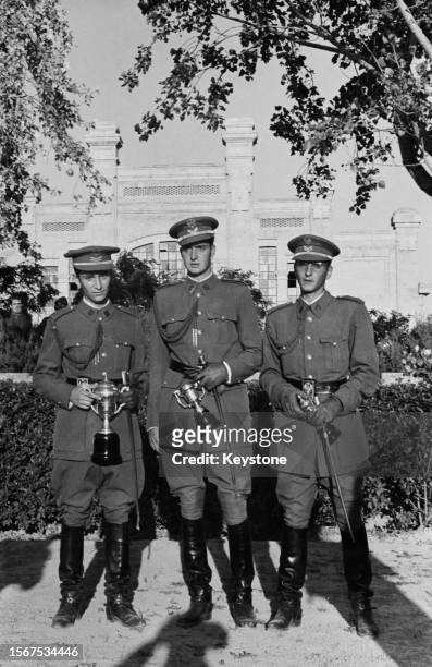 Spanish Royal Juan Carlos, Prince of Asturias , with two other cadets, all in military uniform, at the General Military Academy in Zaragoza, Aragon,...