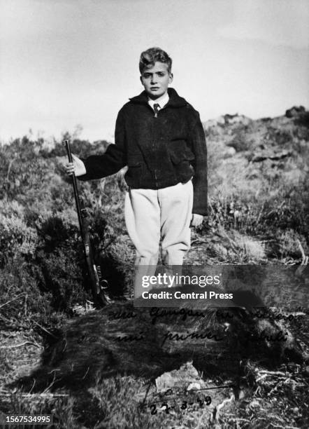 Spanish Royal Juan Carlos, Prince of Asturias poses with a rifle and the body of a wild boar, a hunting trophy on the ground before him, 27th March...