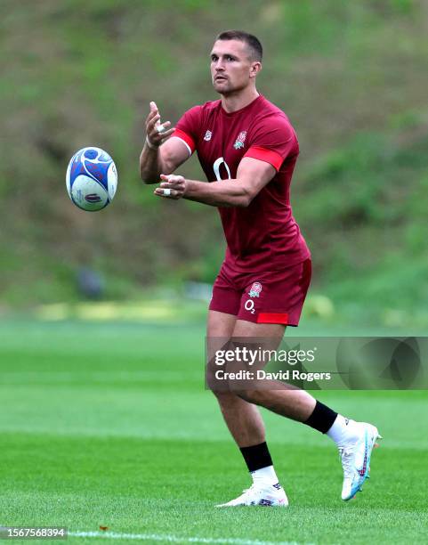 Henry Slade passes the ball during the England training session held at Pennyhill Park on July 24, 2023 in Bagshot, England.