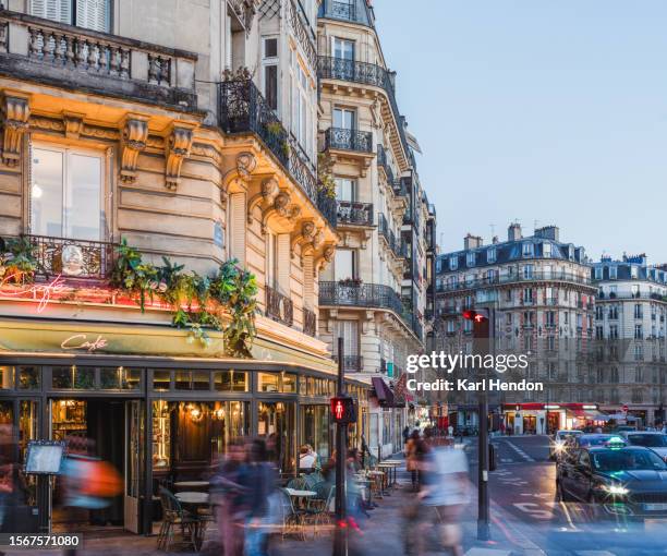 a paris cafe and streets at dusk - paris restaurant stock pictures, royalty-free photos & images