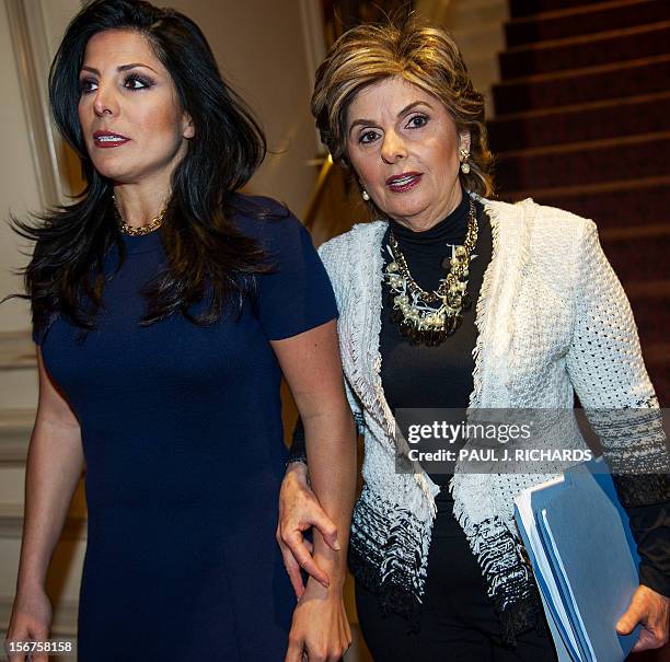 Attorney Gloria Allred and client Natalie Khawam, walk together to conduct a press conference November 20 at the Ritz-Carlton hotel in Washington,...