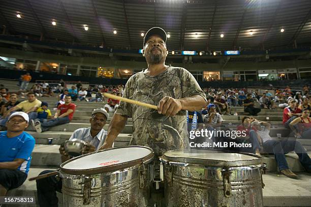 Fan is seen playing the drums in the stands during Game 4 of the Qualifying Round of the World Baseball Classic against Team Nicaragua at Rod Carew...