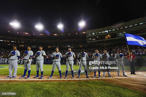 Members of Team Nicaragua are seen on the base path during the playing of the National Anthems before Game 4 of the Qualifying Round of the World...