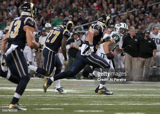 Tight End Konrad Reuland of the New York Jets has a long gain against the St. Louis Rams at Edward Jones Dome on November 18, 2012 in St Louis,...