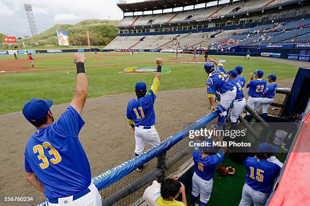 Team Brazil reacts in the dugout after retaking the lead in the bottom of the fifth inning during Game 3 of the Qualifying Round of the World...