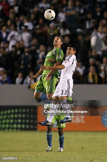 Jose Villareal of the Los Angeles Galaxy and Jeff Parke of the Seattle Sounders vie for a high ball during Leg 1 of the Western Conference...