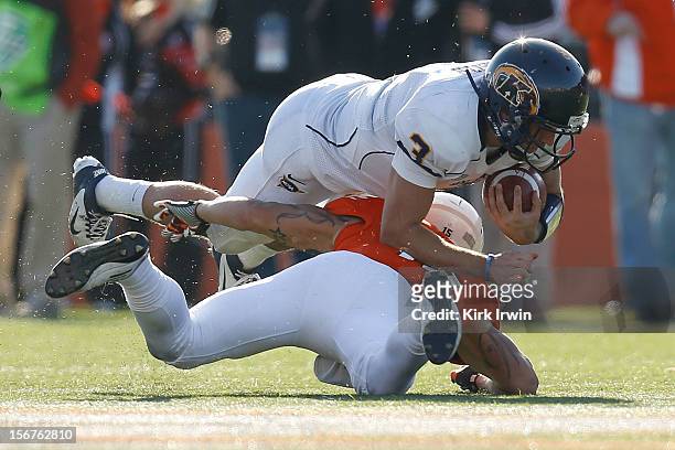Spencer Keith of the Kent State Golden Flashes is tackled by Ryland Ward of the Bowling Green Falcons on November 17, 2012 at Doyt Perry Stadium in...